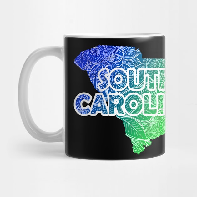 Colorful mandala art map of South Carolina with text in blue and green by Happy Citizen